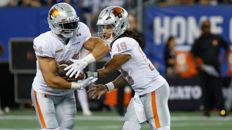 B.C. Lions quarterback Kaidon Salter (19) hands off to Zander Horvath (34) during a CFL game in Winnipeg on Thursday, July 30, 2026. (John Woods/CP)