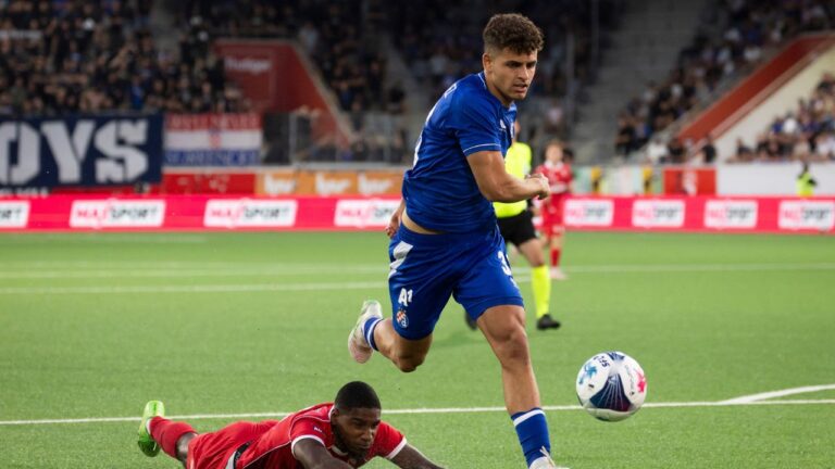 Brighton Labeau, bottom, and Sergi Dominguez battle for the ball during a Champions League match between Switzerland's FC Thun and Croatia's Dinamo Zagreb, on Tuesday, July 21, 2026, at the Visana Stadion in Thun, Switzerland. (Peter Klaunzer/Keystone/AP)