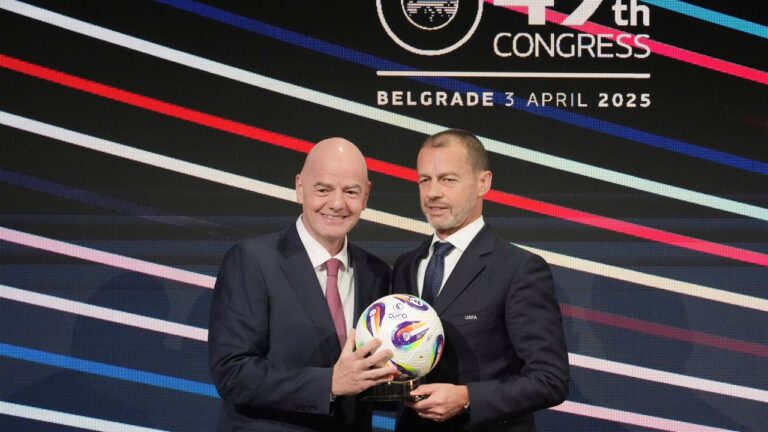 UEFA President Aleksander Ceferin and FIFA president Gianni Infantino, left, holding a ball during the 49th UEFA congress in Belgrade, Serbia, Thursday, April 3, 2025. (Darko Vojinovic/AP)