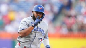 Toronto Blue Jays' Vladimir Guerrero Jr. reacts after hitting a solo home run off Philadelphia Phillies pitcher Aaron Nola during the first inning of a baseball game, Saturday, Aug. 8, 2026, in Philadelphia. (Derik Hamilton/AP)