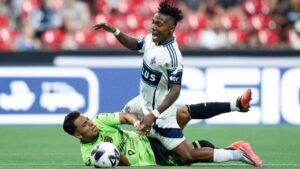 Vancouver Whitecaps' Edier Ocampo (top) and Juarez FC's Ian Torres (10) collide during the second half of a Leagues Cup soccer match in Vancouver, on Friday, August 7, 2026. (Ethan Cairns/CP)