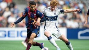 Atlante FC's Luis Calzadilla, left, and Vancouver Whitecaps' Oliver Larraz (8) vie for the ball during the first half of a Leagues Cup soccer match in Vancouver, on Tuesday, August 4, 2026. (Ethan Cairns/CP)