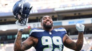 Seattle Seahawks' Leonard Williams responds to fans during warmups before an NFL preseason football game against the Dallas Cowboys, Saturday, Aug. 15, 2026, in Seattle. (Lindsey Wasson/AP)