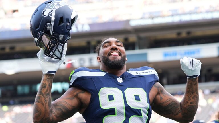 Seattle Seahawks' Leonard Williams responds to fans during warmups before an NFL preseason football game against the Dallas Cowboys, Saturday, Aug. 15, 2026, in Seattle. (Lindsey Wasson/AP)