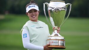 Miyu Yamashita, of Japan, poses with the trophy after winning the LPGA CPKC Canadian Women's Open golf tournament, in Edmonton, on Sunday, Aug. 23, 2026. (Darryl Dyck/CP)