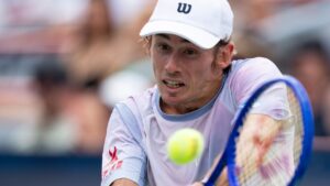 Alex De Minaur of Australia hits a return to Cameron Norrie of Great Britain during third round tennis action at the National Bank Open in Montreal on Thursday, Aug. 6, 2026. (Christinne Muschi/CP)