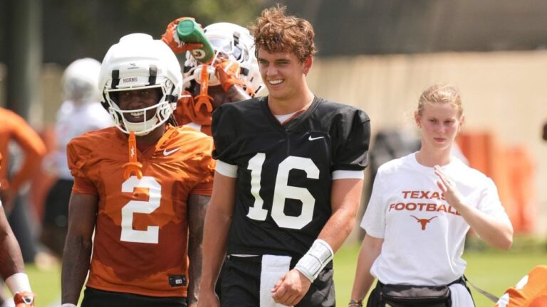 Texas quarterback Arch Manning (16) and running back Hollywood Smothers (2) take part in an NCAA college preseason football camp in Austin, Texas, Wednesday, Aug. 5, 2026. (Eric Gay/AP)