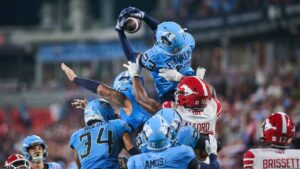 Toronto Argonauts' Benjie Franklin (23) intercepts a pass on the final play to win the game against the Calgary Stampeders during second half CFL football action. (Sammy Kogan/THE CANADIAN PRESS)