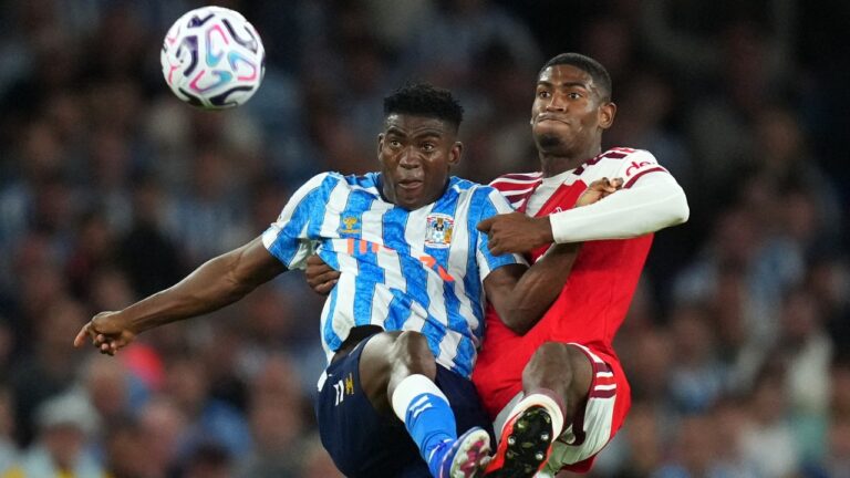 Coventry City's Taiwo Awoniyi fights for the ball with Arsenal's Cristhian Mosquera, right, during the English Premier League soccer match between Arsenal and Coventry City in London, Friday, Aug. 21, 2026. (Kirsty Wigglesworth/AP Photo)