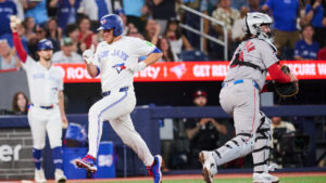 Toronto Blue Jays' Myles Straw (3) scores on an RBI by Brett Bateman (21), not shown, during fifth inning MLB baseball action against the Boston Red Sox in Toronto, on Tuesday, Aug. 11, 2026. (Sammy Kogan/CP)