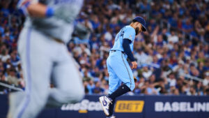 Toronto Blue Jays pitcher Simeon Woods Richardson (10) reacts as Kansas City Royals' Vinnie Pasquantino (9) rounds the bases after hitting a two-run home run during sixth inning MLB baseball action in Toronto, on Thursday, Aug. 27, 2026. (Sammy Kogan/CP)