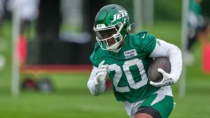 New York Jets' Breece Hall runs the ball during practice at the team’s NFL football training camp. (Seth Wenig/AP)
