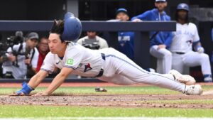 Toronto Blue Jays' Brett Bateman, right, scores on a wild pitch during fifth inning MLB baseball action against the Seattle Mariners, in Toronto on Saturday, Aug. 29, 2026. (Jon Blacker/CP)