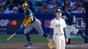 Milwaukee Brewers' William Contreras, left, heads to first for a two-run home run as Los Angeles Dodgers starting pitcher Justin Wrobleski and catcher Hunter Feduccia watch during the fourth inning of a baseball game Saturday, Aug. 15, 2026, in Los Angeles. (Mark J. Terrill/AP)