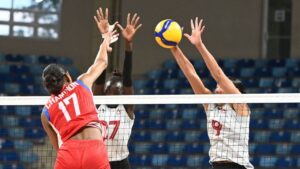 Canada's Alexa Gray, right, and Nyadholi Thokbuom, centre, go up to block a hit from Puerto Rico's Decelise Champion during a Women's NORCECA Continental Qualifier volleyball match in Santo Domingo, Dominican Republic in this Friday, August 28, 2026 handout photo. (CP Handout - Volleyball Canada)