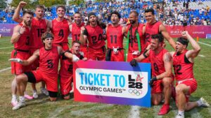 Team Canada celebrates the Olympic qualification for LA 26 after winning the Flag Football World Championship men's bronze medal game between Canada and Mexico. (Martin Meissner/AP)