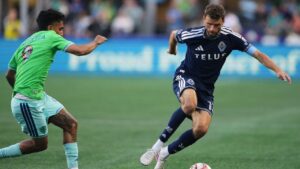 Vancouver Whitecaps forward Thomas Müller, right, moves the ball against Seattle Sounders forward Jesús Ferreira (9) during the first half of an MLS soccer match, Sunday, Aug. 16, 2026, in Seattle. (Lindsey Wasson/AP)