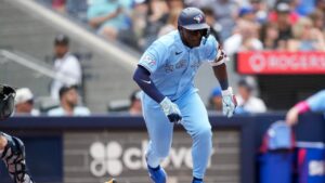 Toronto Blue Jays outfielder Daz Cameron (23) hits a RBI double against the New York Yankees during fifth inning American League MLB baseball action in Toronto on Sunday, Aug. 16, 2026. (Nathan Denette/CP)