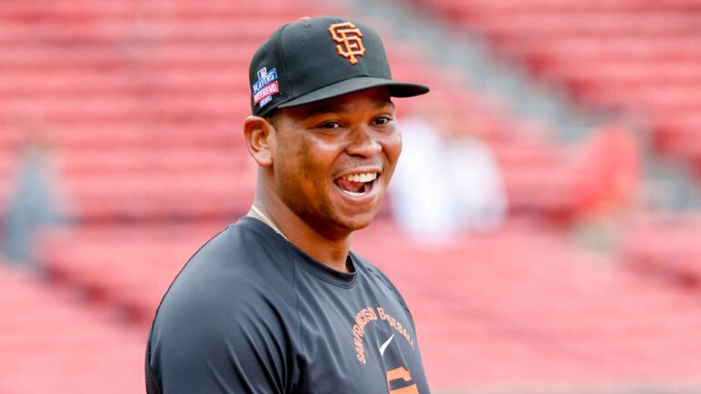 San Francisco Giants' Rafael Devers reacts to being back at Fenway Park before a baseball game against the Boston Red Sox, Friday, Aug. 21, 2026, in Boston. (Greg M. Cooper/AP Photo)