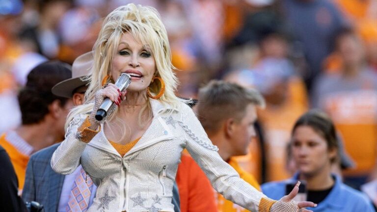 Dolly Parton performs during the first half of an NCAA college football game between Tennessee and Georgia Nov. 18, 2023, in Knoxville, Tenn. (Wade Payne/AP)