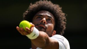 Arthur Fils of France serves the ball during the second round men's singles match against Matteo Berrettini of Italy at the Wimbledon Tennis Championships in London, Thursday, July 2, 2026. (Kirsty Wigglesworth/AP Photo)
