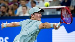 Joao Fonseca from Brazil returns the ball from Casper Ruud from Norway on day six of the National Bank Open tennis tournament in Montreal on Friday, August 7, 2026. (Christopher Katsarov/THE CANADIAN PRESS)