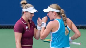 Canada's Gabriela Dabrowski (left) talks to her doubles partner Ekaterina Alexandrova during their match against United States' Coco Gauff and Caty McNally at the National Bank Open in Toronto on Thursday, August 6, 2026. (Chris Young/CP)