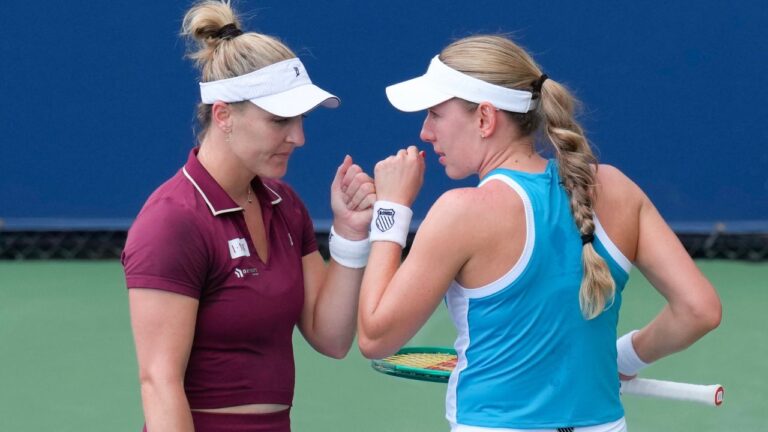 Canada's Gabriela Dabrowski (left) talks to her doubles partner Ekaterina Alexandrova during their match against United States' Coco Gauff and Caty McNally at the National Bank Open in Toronto on Thursday, August 6, 2026. (Chris Young/CP)