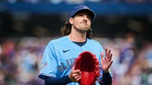 Toronto Blue Jays' Kevin Gausman (34) applauds to the crowd as he is taken out of the game by manager John Schneider during sixth inning MLB baseball action against the St. Louis Cardinals in Toronto, on Saturday, Aug. 1, 2026. (Sammy Kogan/THE CANADIAN PRESS)