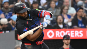 Toronto Blue Jays infielder Vladimir Guerrero Jr. (27) hits a single against the Texas Rangers during fourth inning MLB baseball action in Toronto on Friday, June 26, 2026. (Jon Blacker/CP)
