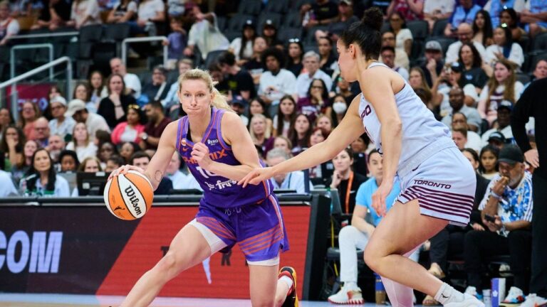 Phoenix Mercury's Lexi Held (10) drives past Toronto Tempo's Kia Nurse (11) during first half WNBA basketball action in Toronto, on Saturday, June 27, 2026. (Sammy Kogan/CP)