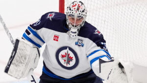 Winnipeg Jets goaltender Connor Hellebuyck gloves a shot from the Dallas Stars in the second period of an NHL hockey game Thursday, April 2, 2026, in Dallas. (Tony Gutierrez/AP)