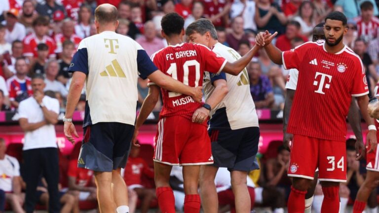 Munich's Jamal Musiala leaves the pitch due to an injury during a pre-season soccer match between FC Bayern Munich and RB Leipzig in Munich, Germany, Saturday, Aug. 15, 2026. (Karl-Josef Hildenbrand/dpa via AP)
