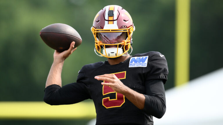 Washington Commanders quarterback Jayden Daniels works out before a joint practice with the Miami Dolphins at NFL football training camp, Wednesday, Aug. 12, 2026 in Ashburn, Va. (Nick Wass/AP)