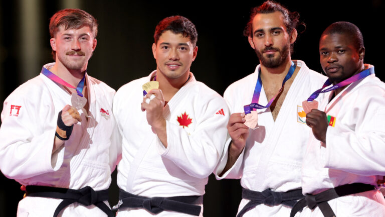 From left: Silver medalist Max Gregory of England, gold medalist Kyle Reyes of Canada, and bronze medalists Franck Ulrick Tahman Zan of Cameroon and Georgios Kroussaniotakis of Cyprus pose with their medals after the Men's Judo -100 kg competition, on day ten of the 2026 Commonwealth Games in Glasgow, Scotland, Sunday Aug. 2, 2026. (Steve Welsh/PA via AP)