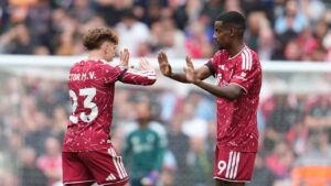 Liverpool's Alexander Isak, right, celebrates with Liverpool's Victor Munoz after scoring his side's opening goal during the English Premier League soccer match between Liverpool and Nottingham Forest. (Jon Super/AP)