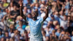 Manchester City's Marc Guehi celebrates after scoring his side's opening goal during the English Premier League soccer match between Manchester City and Bournemouth in Manchester, England, Sunday, Aug. 23, 2026. (Dave Thompson/AP)