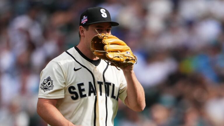 Seattle Mariners relief pitcher Michael Rucker reacts to walking Chicago Cubs' Ian Happ with the bases loaded to drive in a run during the eighth inning of a baseball game, Sunday, Aug. 23, 2026, in Seattle. (Lindsey Wasson/AP Photo)