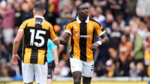 Hull City's Nobel Mendy, right, celebrates scoring during the English Premier League soccer match between Hull City and Manchester United in Kingston upon Hull, England, Saturday Aug. 22, 2026. (Annabel Lee-Ellis/PA via AP)