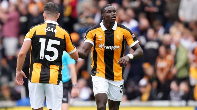 Hull City's Nobel Mendy, right, celebrates scoring during the English Premier League soccer match between Hull City and Manchester United in Kingston upon Hull, England, Saturday Aug. 22, 2026. (Annabel Lee-Ellis/PA via AP)