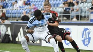 D.C. United's Jackson Hopkins (25) challenges CF Montreal's Brayan Ceballos (3) for the ball during first half MLS soccer action in Montreal. (Graham Hughes/THE CANADIAN PRESS)