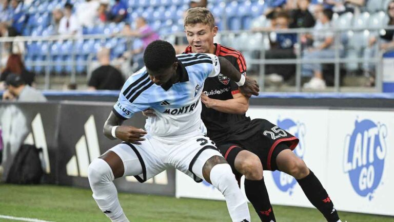 D.C. United's Jackson Hopkins (25) challenges CF Montreal's Brayan Ceballos (3) for the ball during first half MLS soccer action in Montreal. (Graham Hughes/THE CANADIAN PRESS)