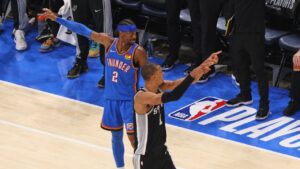 San Antonio Spurs forward Victor Wembanyama (1) and Oklahoma City Thunder guard Shai Gilgeous-Alexander (2) both appeal for possession in the second half of Game 7 of the Western Conference finals of the NBA basketball playoffs series Saturday, May 30, 2026, in Oklahoma City. (Nate Billings/AP)
