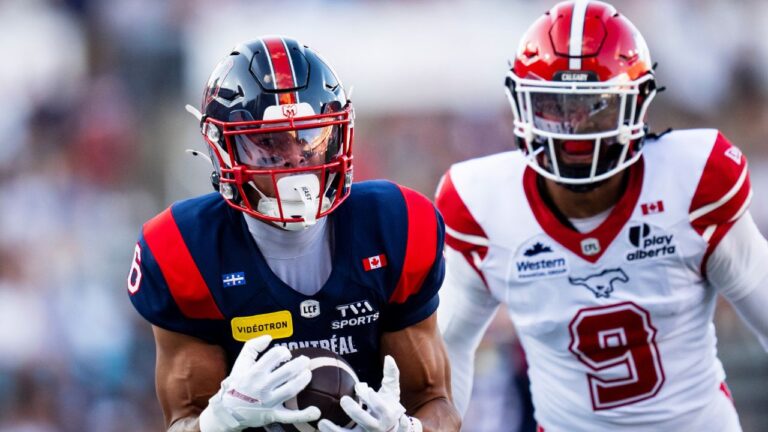 Montreal Alouettes' Tyson Philpot (6) makes a catch against Calgary Stampeders' Damon Webb (9) during first half CFL football action in Montreal on Saturday, July 11, 2026. (Christopher Katsarov/THE CANADIAN PRESS)