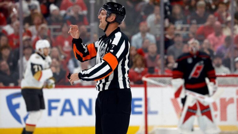 Referee Garrett Rank (7) makes a call during the second period in Game 2 of the NHL hockey Stanley Cup Final series between the Carolina Hurricanes and the Vegas Golden Knights in Raleigh, N.C., June 4, 2026. (Karl DeBlaker/AP)
