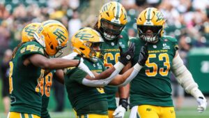 Edmonton Elks' Justin Rankin (5), centre, celebrates a touchdown against the Toronto Argonauts during second half CFL football action in Edmonton on Saturday, Aug. 15, 2026. (Codie McLachlan/CP)