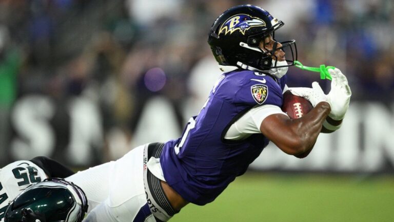 Baltimore Ravens wide receiver Ja'Kobi Lane, right, stretches to score a touchdown as he is defended by Philadelphia Eagles cornerback Michael Carter (35) during the first half of an NFL pre-season football game Saturday, Aug. 15, 2026, in Baltimore. (Nick Wass/AP)