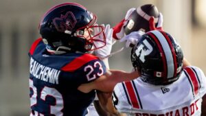 Montreal Alouettes' Nate Beauchemin (23) intercepts a pass to Ottawa Redblacks' Ayden Eberhardt (7) during first half CFL football action in Montreal, on Thursday, August 20, 2026. (Christopher Katsarov/THE CANADIAN PRESS)