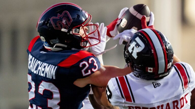 Montreal Alouettes' Nate Beauchemin (23) intercepts a pass to Ottawa Redblacks' Ayden Eberhardt (7) during first half CFL football action in Montreal, on Thursday, August 20, 2026. (Christopher Katsarov/THE CANADIAN PRESS)