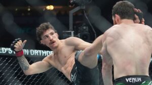 Australia's Quillan Salkilld, left, kicks Israel's Yanal Ashmouz during the first round of a lightweight bout at the UFC 316 mixed martial arts event Saturday, June 7, 2025 in Newark, N.J. (Frank Franklin II/AP)